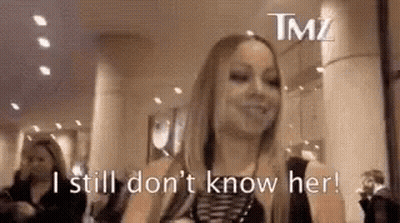 Woman Standing With Sign I Still Don't Know Her GIF
