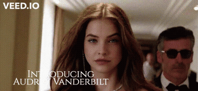 Woman Stands In Front Of Man Introducing Audrey Vanderbilt GIF