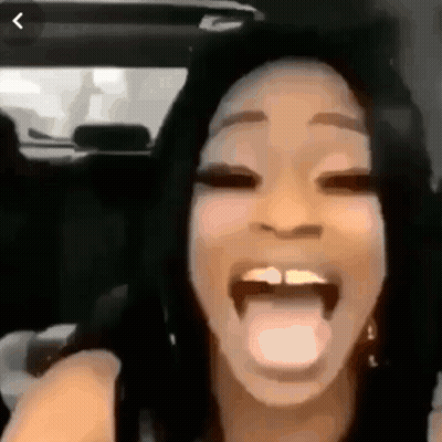 Woman Sticking Out Tongue Sitting In Car GIF