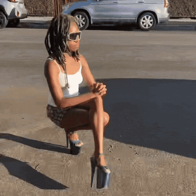 Woman Sticking Tongue Out Dancing In Crowd GIF