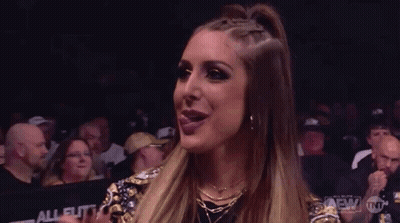 Woman Sticking Tongue Out In Front Of Crowd GIF