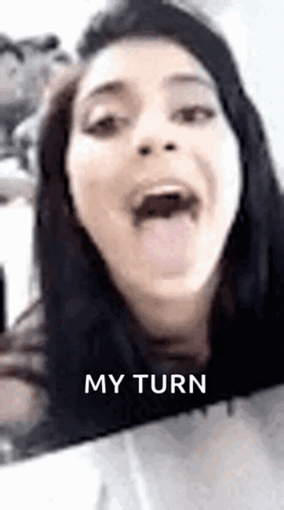 Woman Sticking Tongue Out On Cell Phone GIF