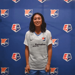 Woman Sticking Tongue Out While Doing Hook Em Sign GIF