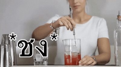 Woman Stirring Drink In Glass GIF