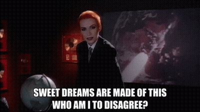 Woman Suit Tie Holding Wand Says Sweet Dreams Are Made Of This Who Am I To Disagree GIF