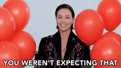 Woman Surrounded By Red Balloons Expecting GIF