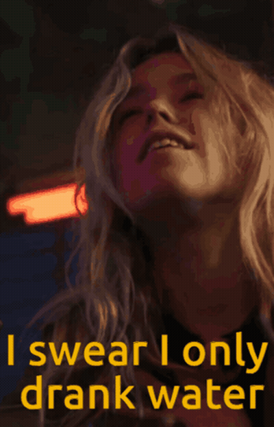 Woman Swears She Only Drank Water Holding Glass GIF