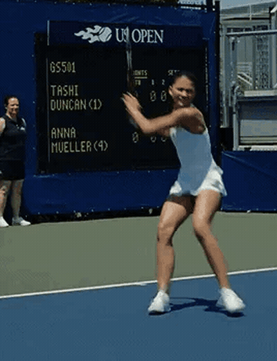 Woman Swinging Tennis Racket At Scoreboard GIF