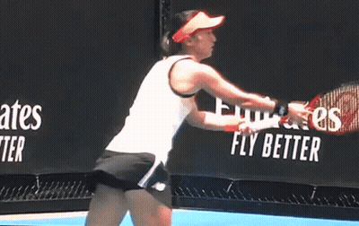 Woman Swinging Tennis Racquet GIF