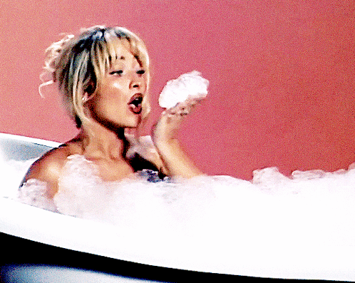 Woman Taking Bath Holding Soap GIF
