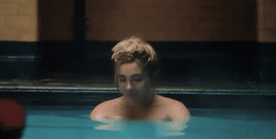 Woman Taking Bath In Blue Pool GIF