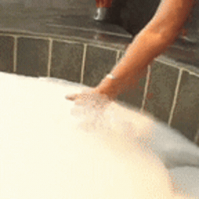 Woman Taking Bath In Bubbles GIF