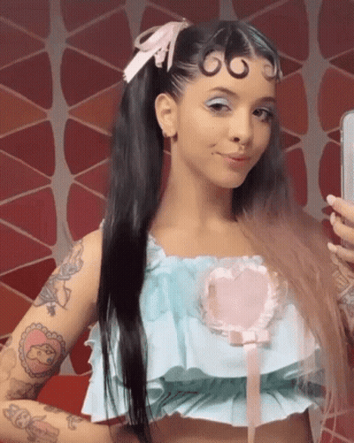 Woman Taking Mirror Selfie Blue Top Pink Heart GIF