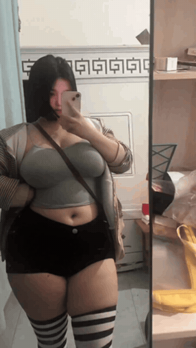 Woman Taking Mirror Selfie GIF