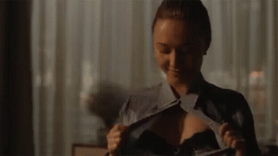 Woman Taking Off Shirt And Bra GIF