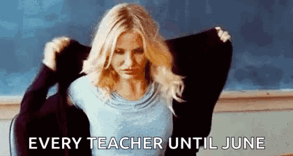 Woman Taking Off Sweater In Classroom GIF