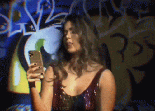 Woman Taking Picture in Front of Graffiti Wall Lesleyanns2