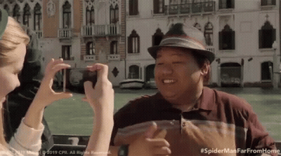 Woman Taking Picture Of Man In Hat #Spidermanfarfromhome GIF