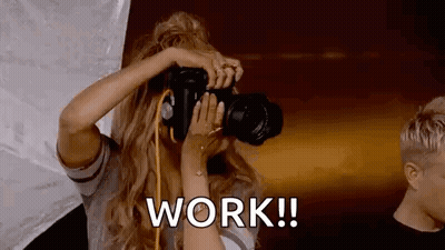 Woman Taking Picture With Work Text GIF