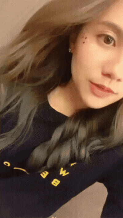 Woman Taking Selfie In Black Shirt With Letter W GIF