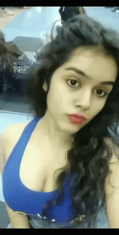 Woman Taking Selfie In Blue Tank Top GIF