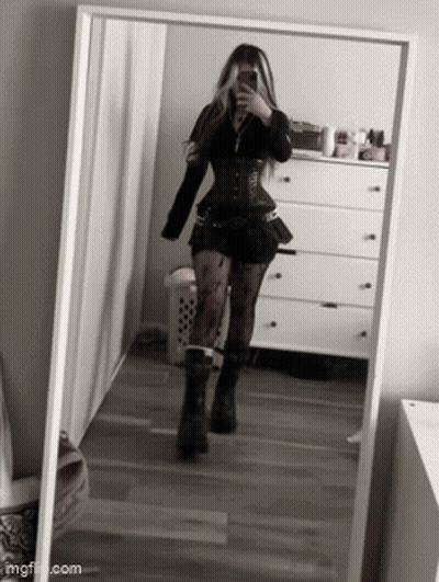 Woman Taking Selfie In Front Of Mirror In Bedroom GIF
