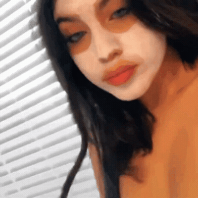 Woman Taking Selfie In Front Of Window GIF