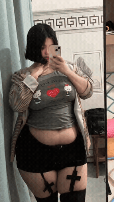 Woman Taking Selfie In Hello Kitty Shirt GIF
