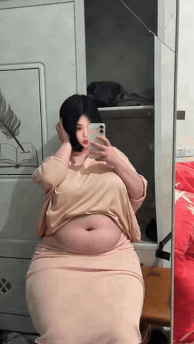 Woman Taking Selfie In Mirror GIF