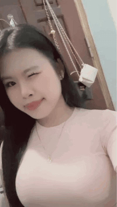 Woman Taking Selfie In Mirror With Purse GIF