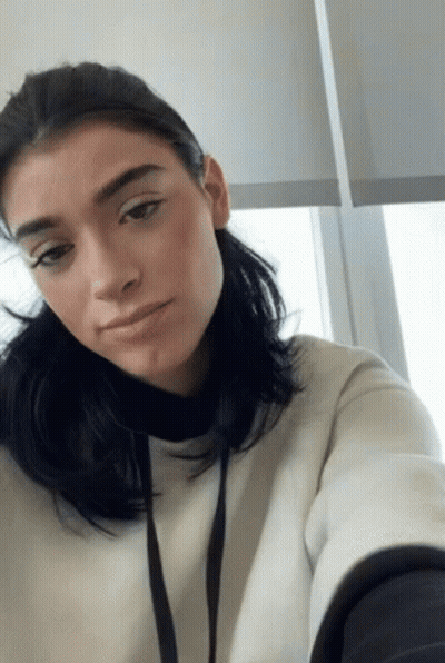 Woman Taking Selfie In White Sweatshirt GIF