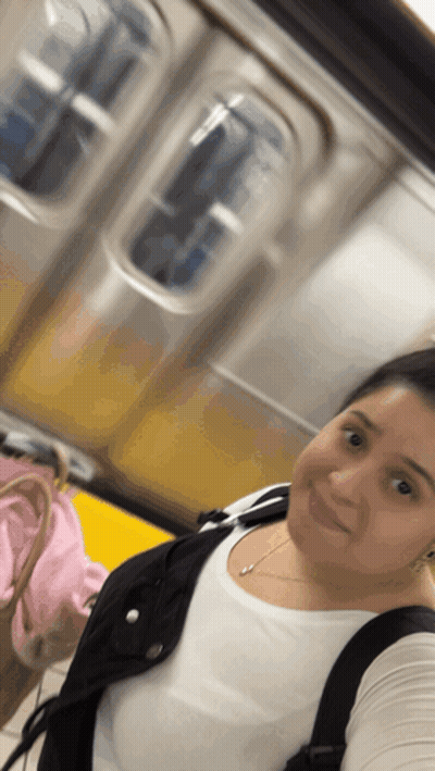 Woman Taking Selfie On Subway GIF