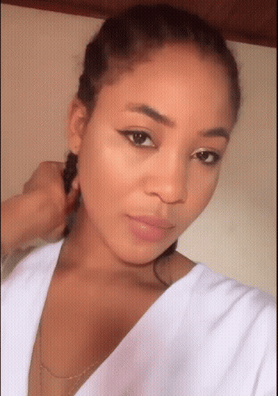 Woman Taking Selfie With Braided Hair GIF