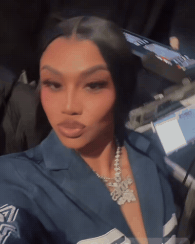 Woman Taking Selfie With I Love You Necklace GIF
