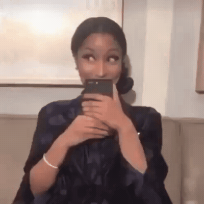 Woman Taking Selfie With Phone On Couch GIF