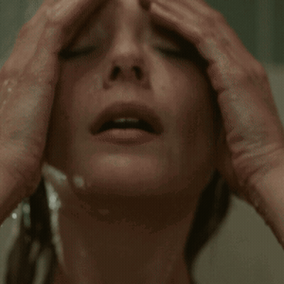 Woman Taking Shower With Eyes Closed GIF
