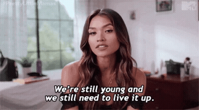 Woman Talking About Being Young And Living It Up In Bedroom GIF