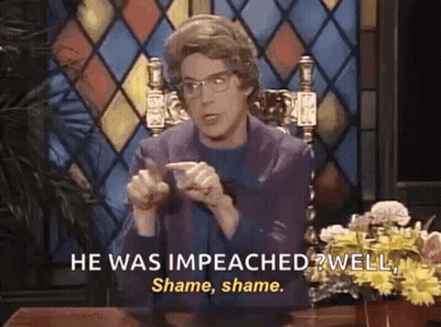 Woman Talking At Desk With Flowers And Stained Glass Window GIF