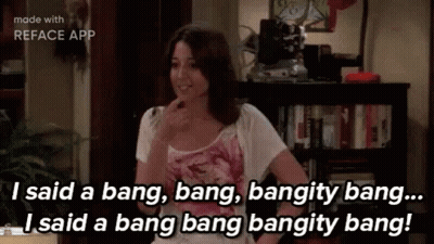 Woman Talking By Bookshelf In Living Room GIF