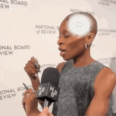 Woman Talking Into Microphone At National Board Of Review GIF