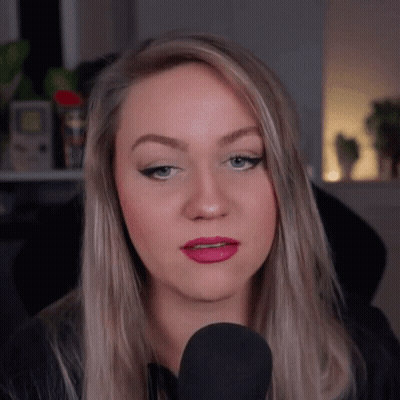 Woman Talking Into Microphone Making Face GIF