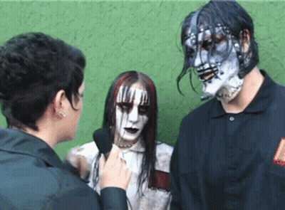 Woman Talking Into Microphone Next To Man And Woman With Makeup GIF