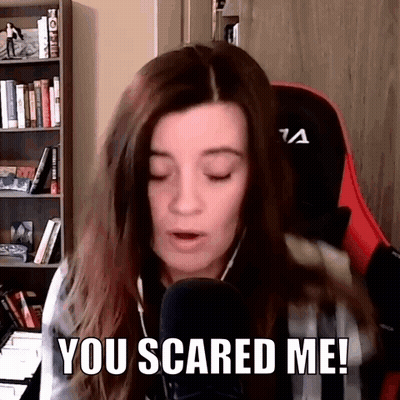 Woman Talking Into Microphone Saying You Scared Me GIF