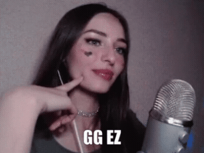 Woman Talking Into Microphone With GG EZ On Face GIF