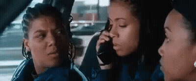 Woman Talking On Cell Phone In Back Seat Of Car GIF