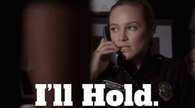 Woman Talking On Cell Phone Saying I'll Hold GIF