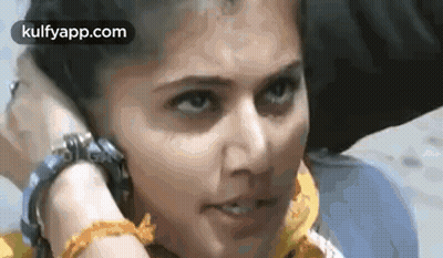 Woman Talking On Cell Phone While Man Holds Her Head GIF