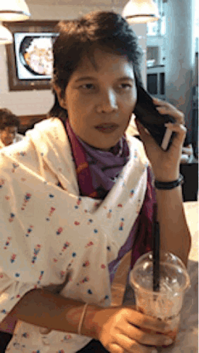 Woman Talking On Cell Phone With Coffee GIF
