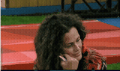 Woman Talking On Cell Phone With Hand On Face GIF
