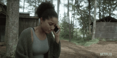 Woman Talking On Cell Phone With Netflix GIF